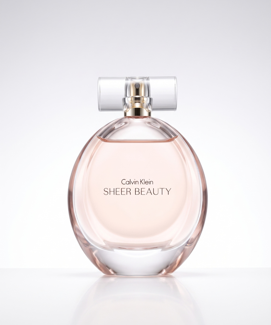 Calvin Klein Sheer Beauty EDT for Women 100ml, elegant oval glass perfume bottle with a transparent cap and soft blush pink fragrance, ideal for everyday wear, available in Abu Dhabi, Dubai and across the UAE.