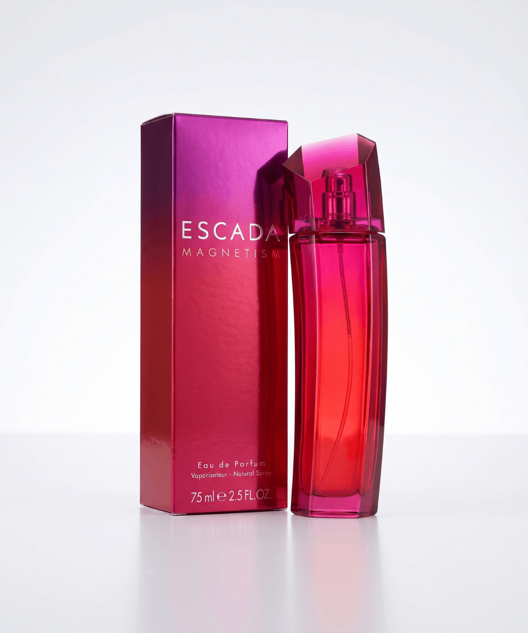 Escada Magnetism Eau de Parfum for Women 75ml, featuring a vibrant red and pink glass perfume bottle with a geometric cap and matching magenta packaging, available for women's designer perfume shopping in Abu Dhabi, Dubai and across the UAE.