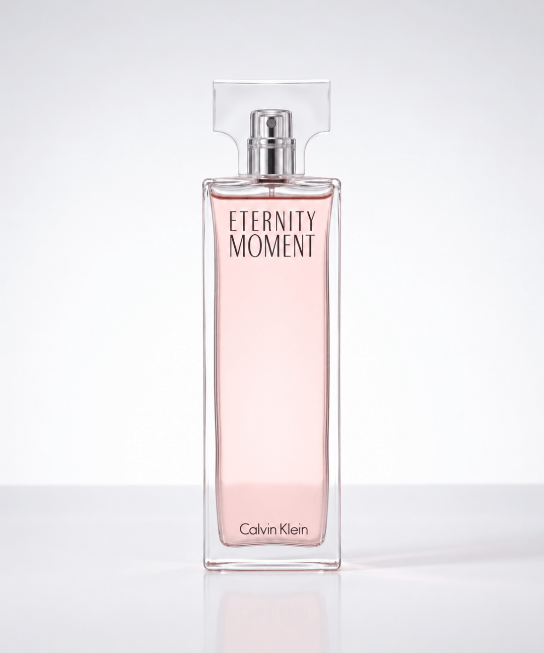 Calvin Klein Eternity Moment Eau de Parfum for Women, featuring an elegant rectangular glass perfume bottle with a soft pink fragrance and transparent cap, available for women's perfume shopping in Abu Dhabi, Dubai and across the UAE.