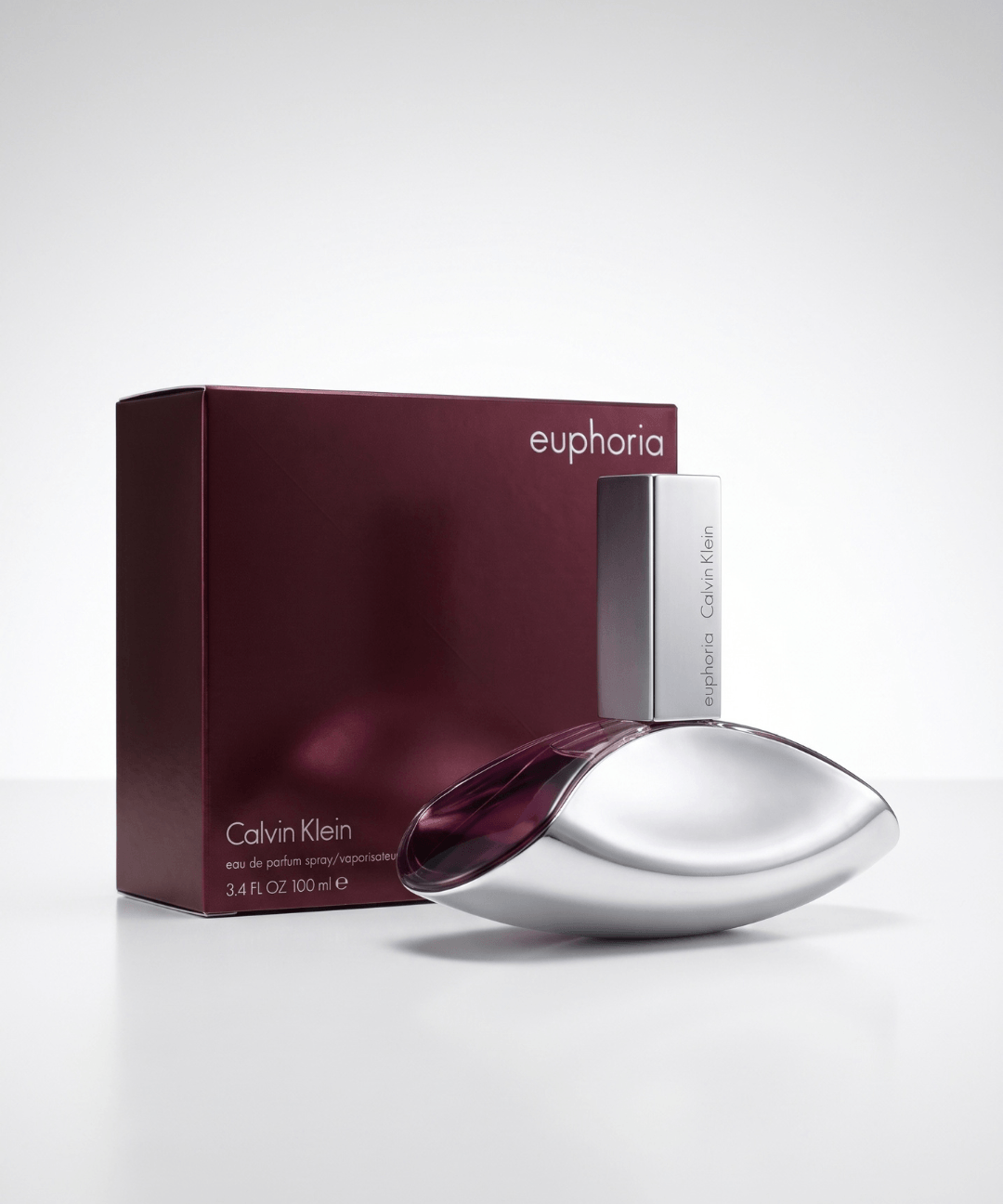 Calvin Klein Euphoria Eau de Parfum for Women 100ml, featuring an elegant silver leaf-shaped perfume bottle with deep purple accents and matching burgundy packaging, available for women's designer perfume shopping in Abu Dhabi, Dubai and across the UAE.