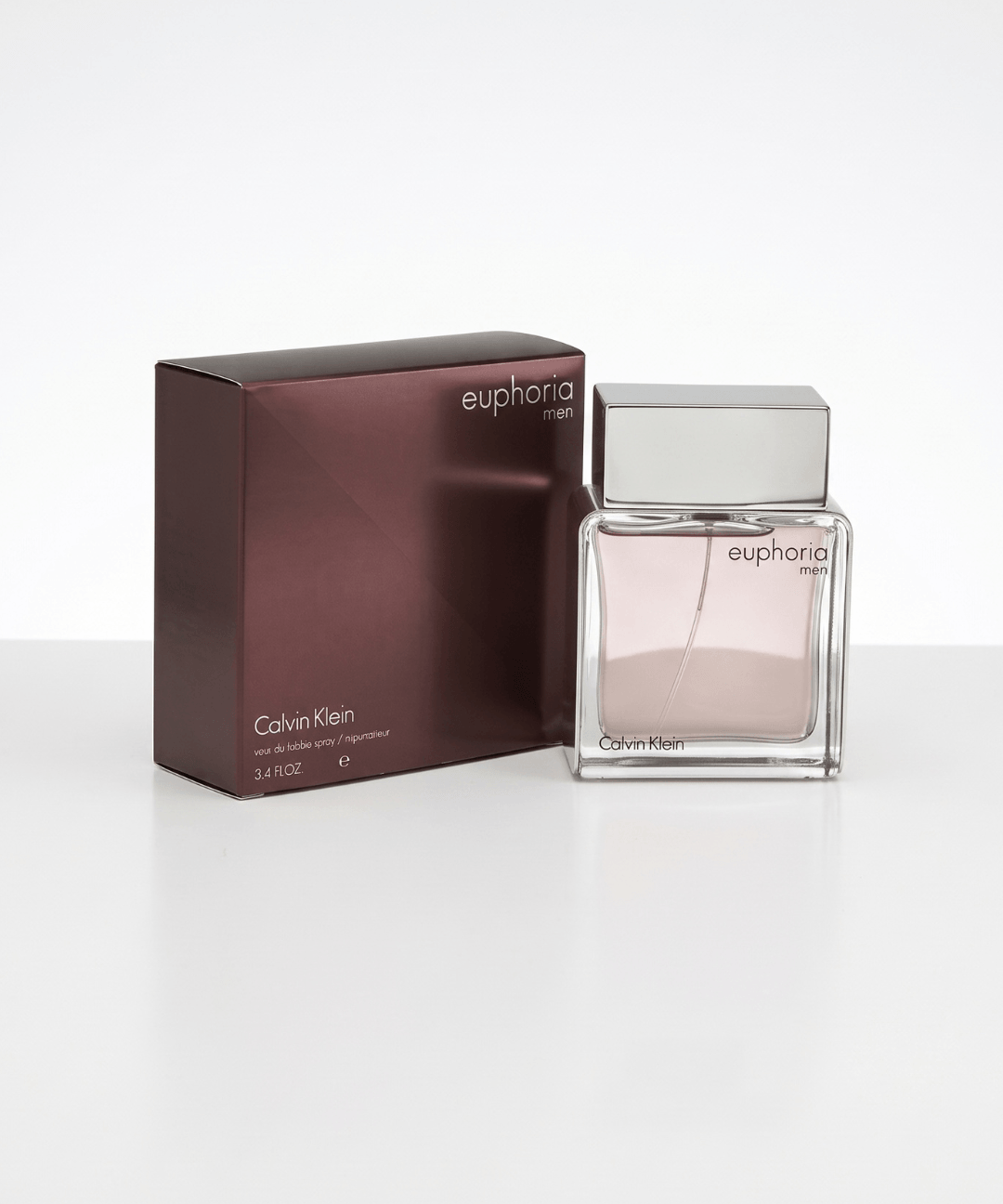 Calvin Klein Euphoria Men Eau de Toilette, featuring a sophisticated rectangular glass perfume bottle with warm amber-brown fragrance and a silver cap, available for men's designer perfume shopping in Abu Dhabi, Dubai and across the UAE.