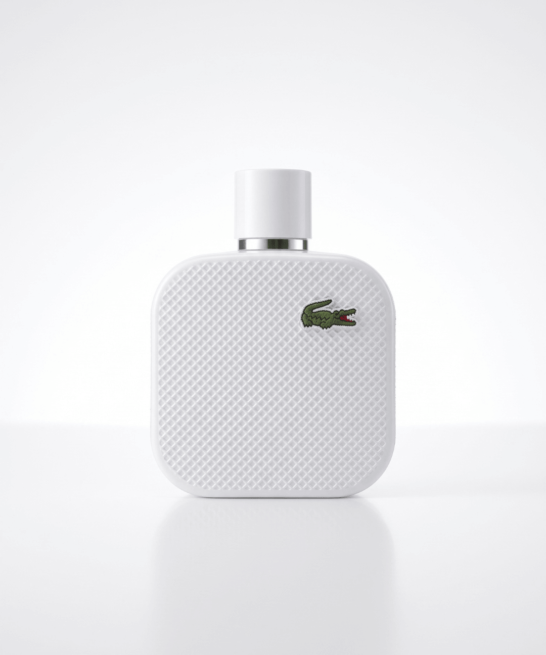 Lacoste L.12.12 Blanc Eau de Toilette for Men 100ml, featuring a white textured rectangular perfume bottle with the signature green crocodile logo and matching white packaging, available for men's designer perfume shopping in Abu Dhabi, Dubai and across the UAE.