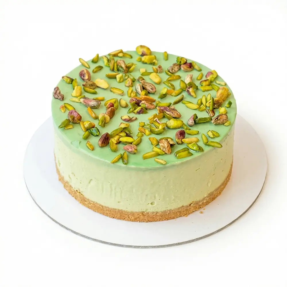 Fresh pistachio cheesecake with crushed pistachio topping – cheesecake delivery Abu Dhabi