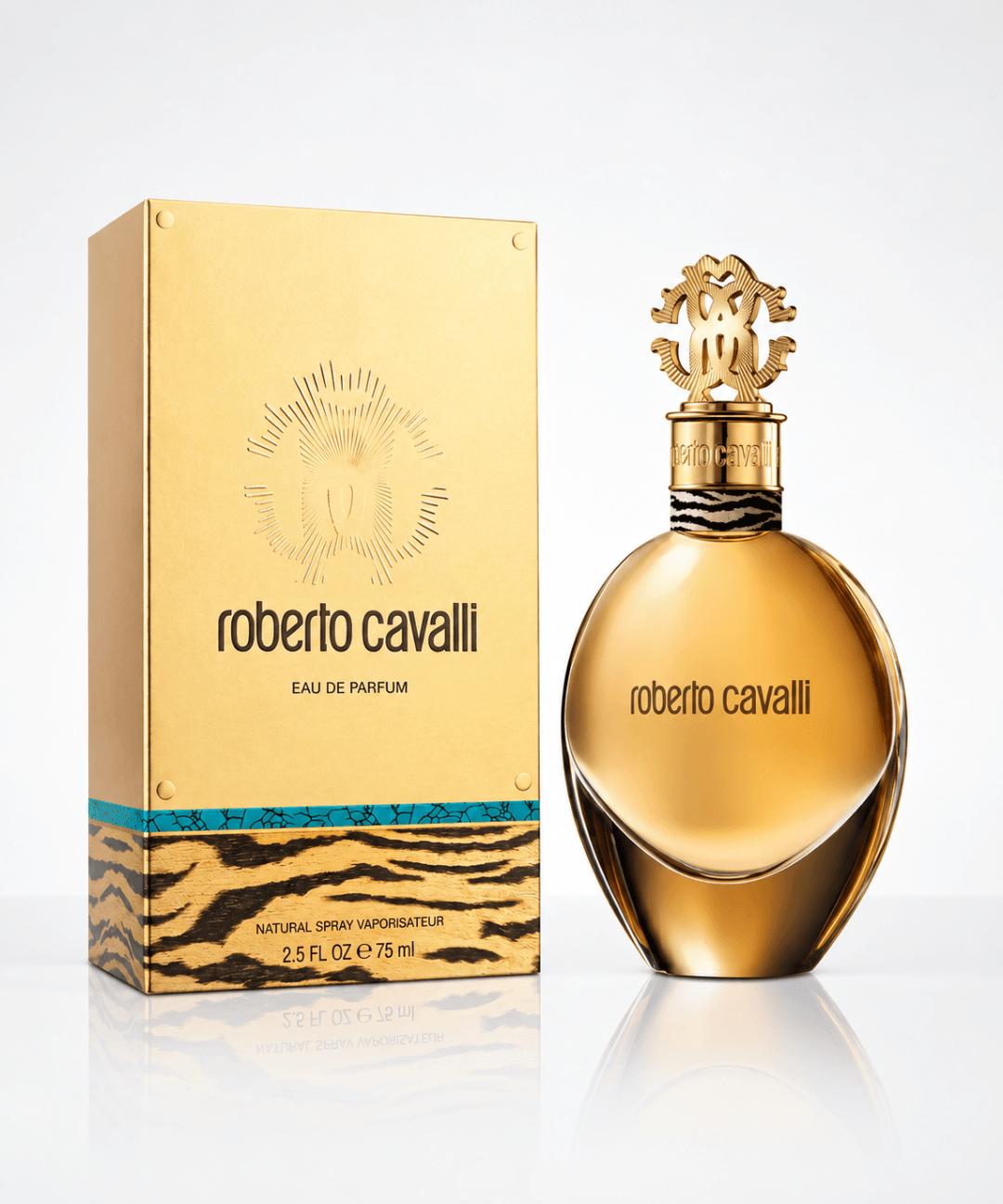Roberto Cavalli Eau de Parfum for Women 75ml, featuring a luxurious golden oval perfume bottle with an ornate gold cap and matching gold packaging with signature tiger-print detailing, available for women's designer perfume shopping in Abu Dhabi, Dubai and across the UAE.