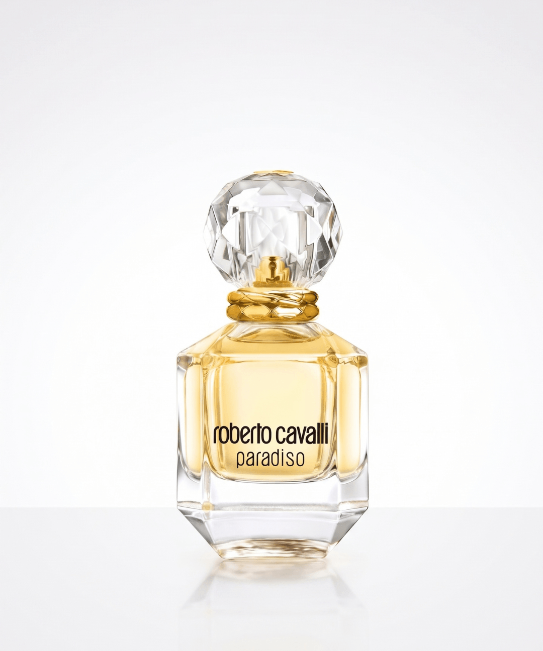 Roberto Cavalli Paradiso Eau de Parfum for Women 75ml, featuring an elegant transparent glass perfume bottle with golden fragrance, a crystal-cut cap and matching turquoise and gold packaging, available for women's luxury perfume shopping in Abu Dhabi, Dubai and across the UAE.