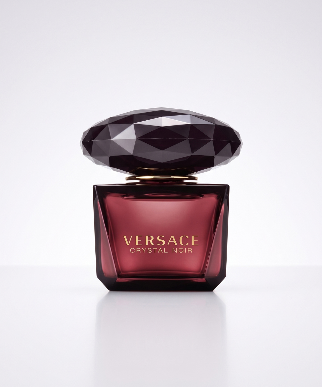 Versace Crystal Noir EDT for Women 90ml, luxurious dark burgundy perfume in a black crystal-cut glass bottle with matching packaging, available for perfume shopping in Abu Dhabi, Dubai and across the UAE.