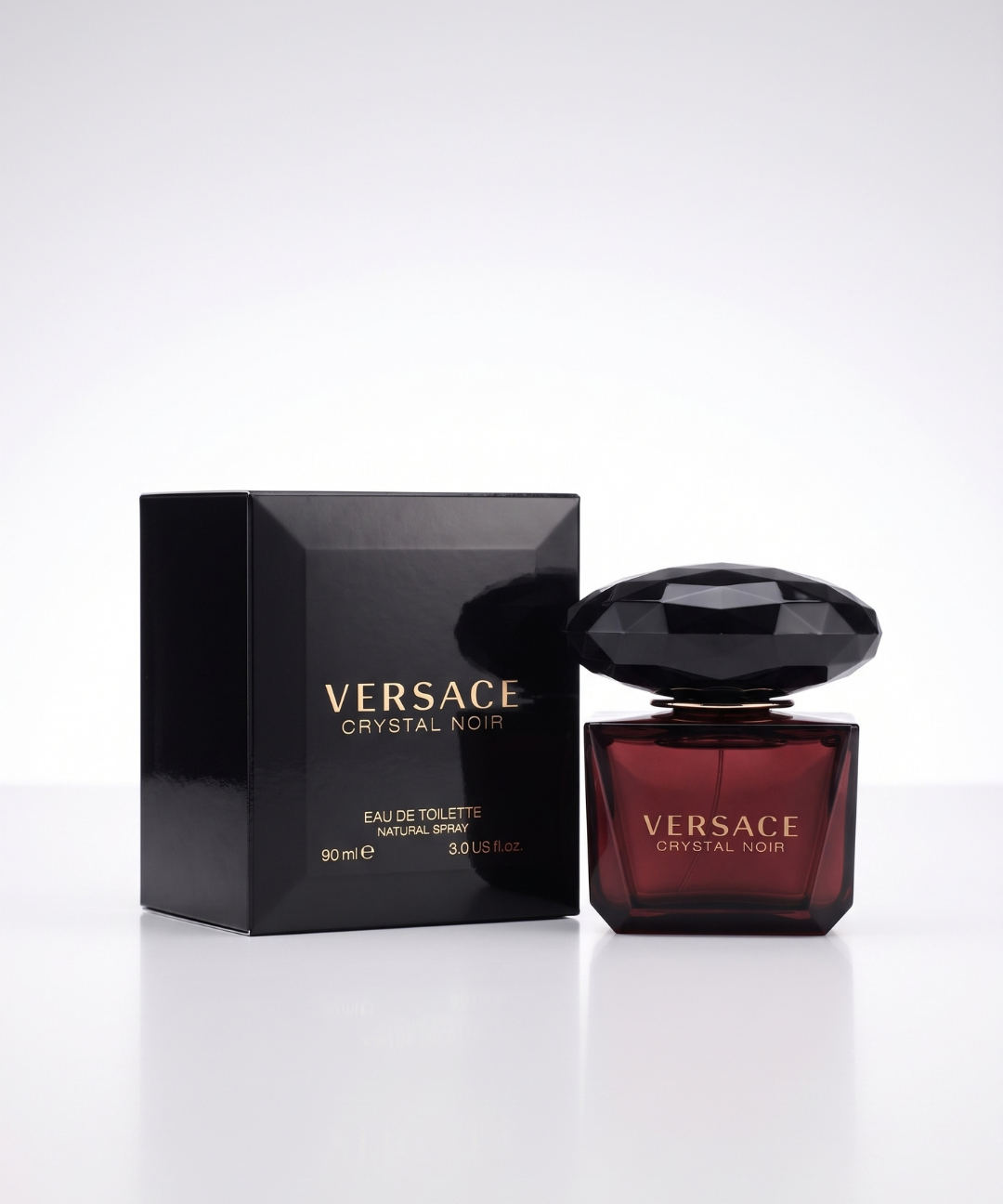 Versace Crystal Noir EDT for Women 90ml, luxurious dark burgundy perfume in a black crystal-cut glass bottle with matching packaging, available for perfume shopping in Abu Dhabi, Dubai and across the UAE.