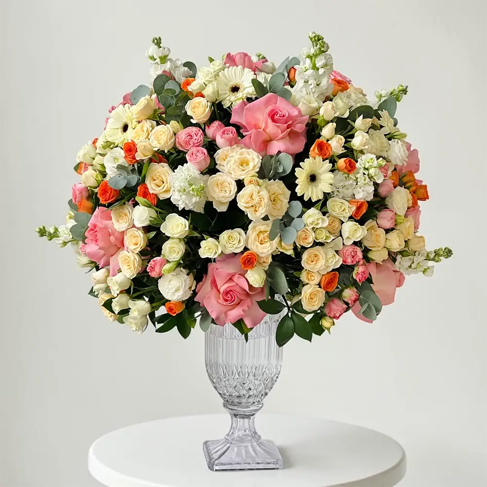 Elegant flower arrangement featuring Pink Rose Hermosa, Gerbera Flowers, Spray Roses, and White Matthiola in a glass vase. Perfect for corporate gifting, birthdays, and thank you gifts.