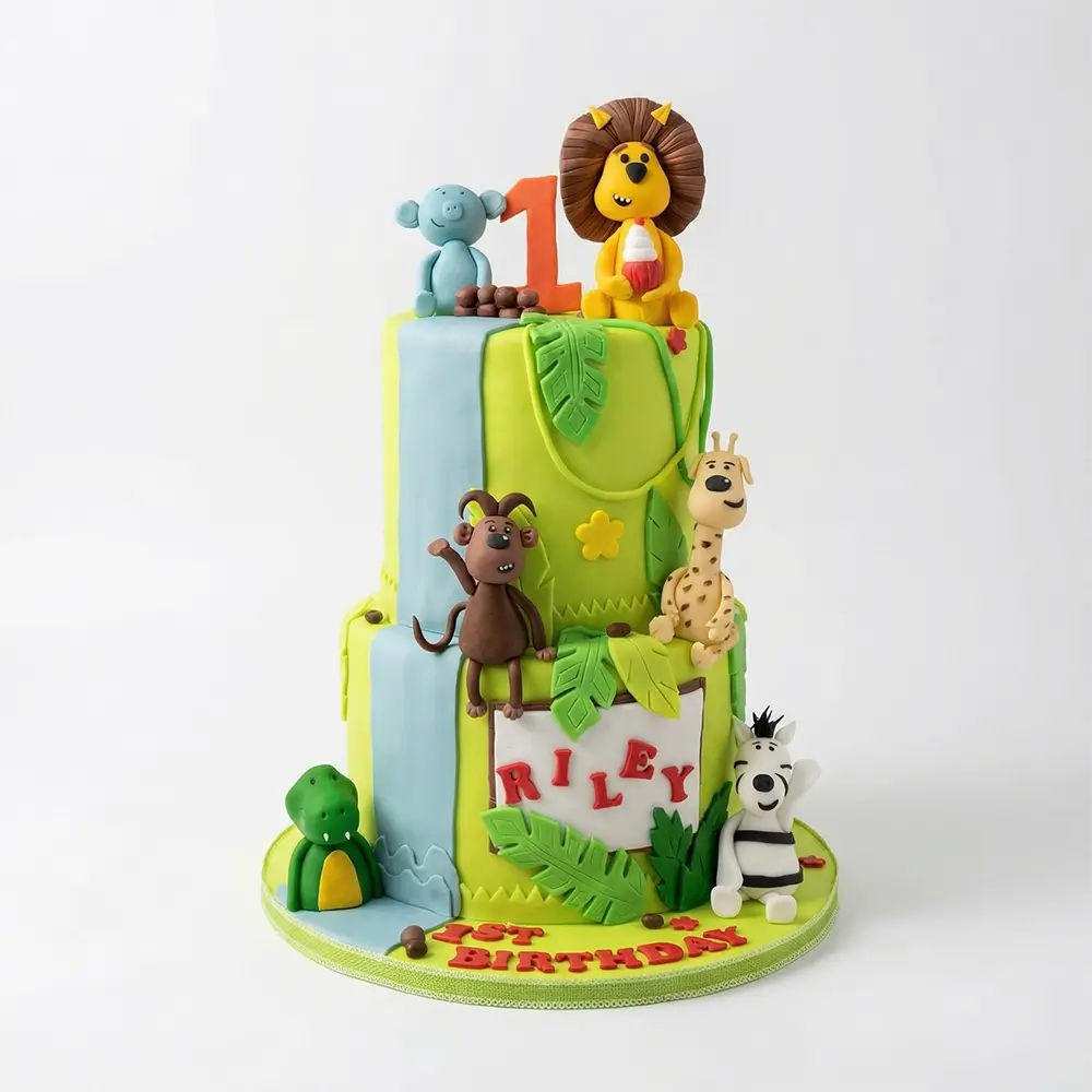 Two-tier jungle theme 1st birthday cake with fondant lion, monkey, giraffe, zebra and personalised name board, Petal Box Abu Dhab