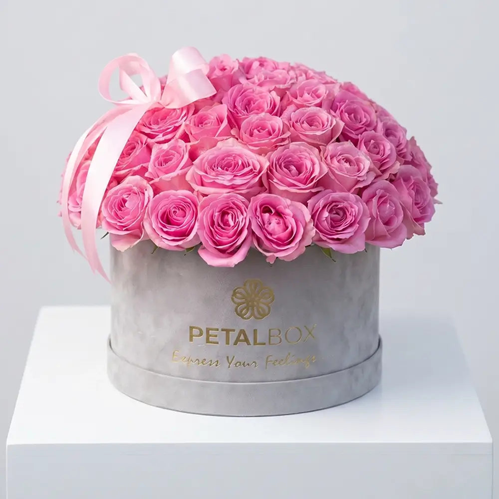 Luxury pink rose flower box arrangement with fresh pink roses in a premium velvet Petal Box, styled for elegant gifting in Abu Dhabi and Dubai.