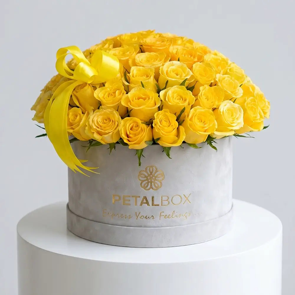 Luxury yellow rose flower box arrangement with fresh yellow roses and elegant ribbon in a premium Petal Box, perfect for gifting in Abu Dhabi and Dubai.