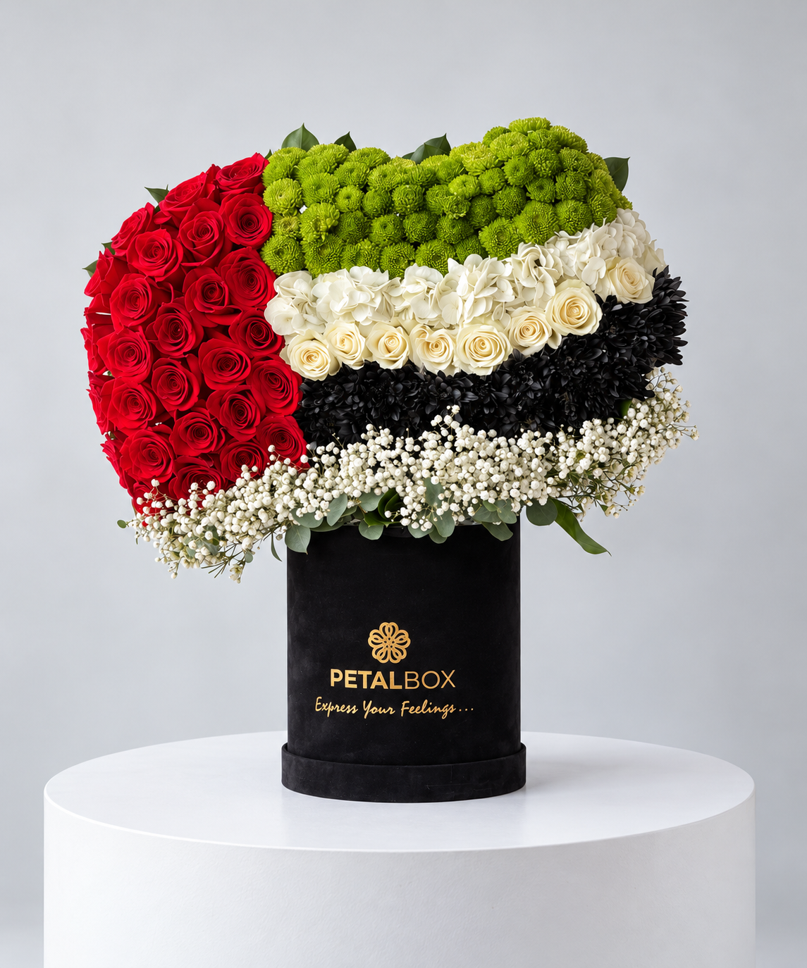 UAE flag design in red roses, green and black chrysanthemums in a black box