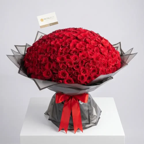 Luxury mega red rose dome bouquet with premium black wrapping and elegant red ribbon, featuring hundreds of fresh red roses for grand romantic gifting and special occasions.