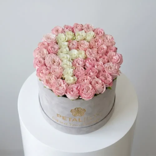 Luxury pink and white heart-shaped rose flower box arrangement in a premium velvet Petal Box, designed for romantic gifting and special occasions.