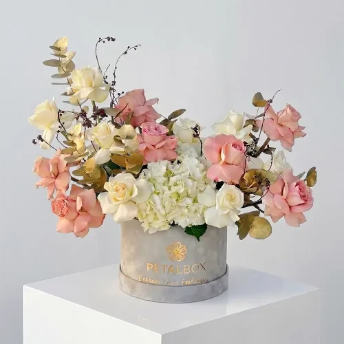 Luxury Cappuccino Blush flower hatbox with cappuccino roses, white hydrangea, white roses and gold eucalyptus by Petal Box