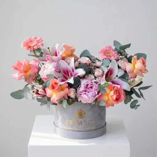 Luxury peony and Hermosa rose hat box with lilies and eucalyptus by Petal Box UAE