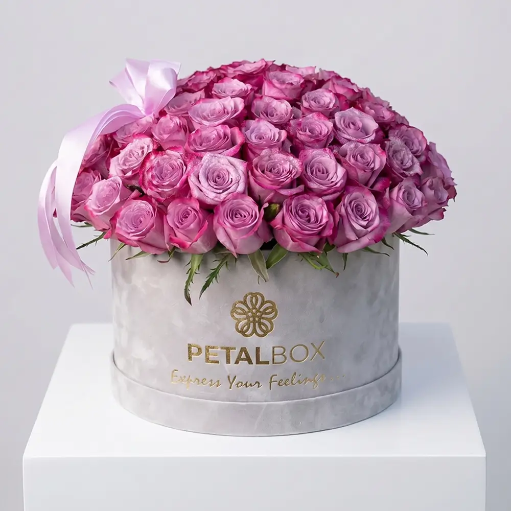Luxury purple rose flower box arrangement with fresh lavender roses in a premium velvet Petal Box, styled for elegant gifting in Abu Dhabi and Dubai.