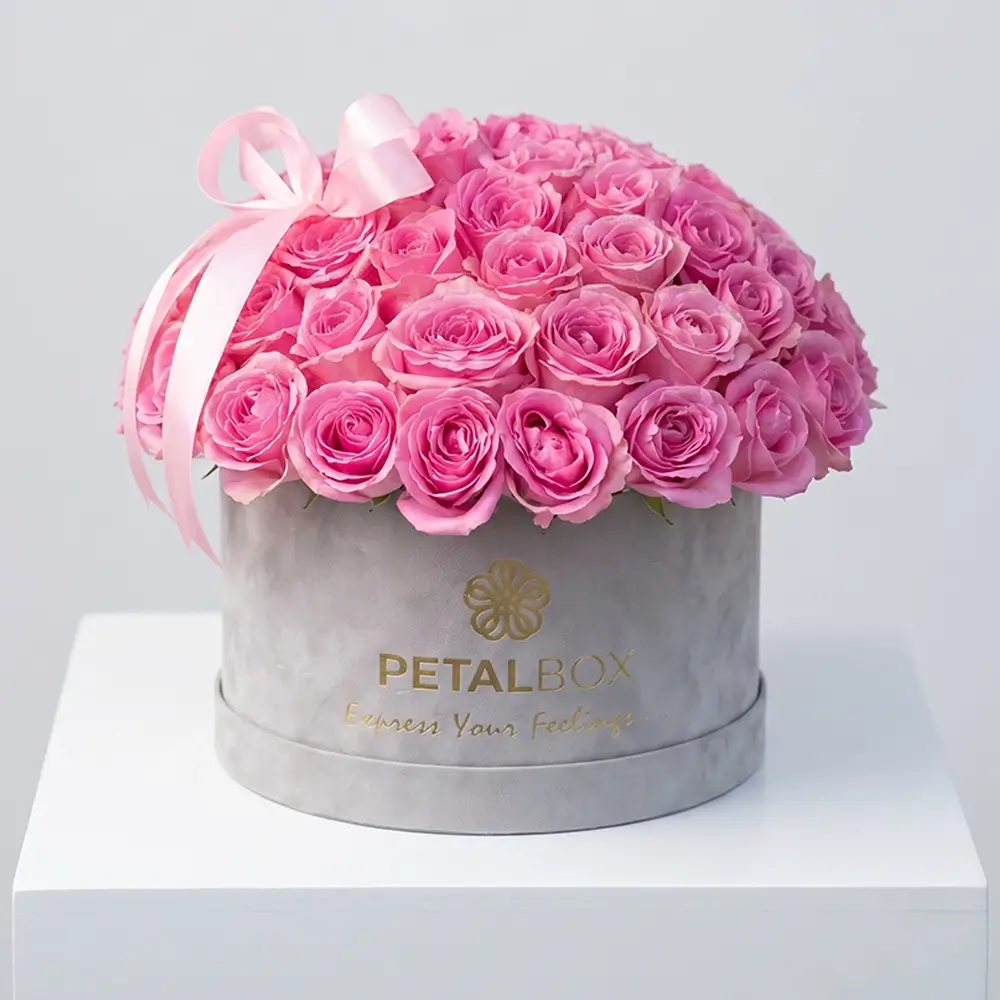 Luxury pink rose flower box arrangement with fresh pink roses in a premium velvet Petal Box, styled for elegant gifting in Abu Dhabi and Dubai.