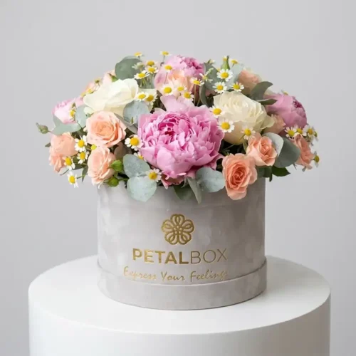 Pink peony flower box with white roses, Sweet Sara spray roses, tanacetum, eucalyptus, and green leaves for delivery in Dubai and Abu Dhabi.